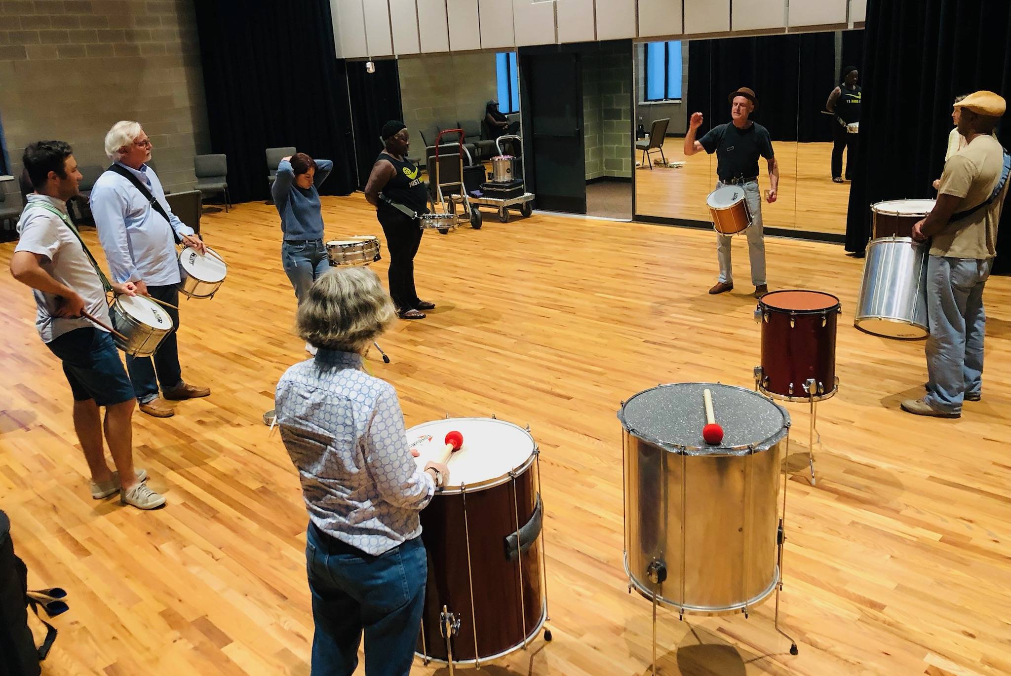 Andrew Harztell leading an indoor drumming class at the Cultural Arts Center